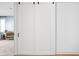 Stylish white sliding bedroom doors with black hardware accents provide separation and privacy at 2140 Alabama St, Indianapolis, IN 46202