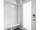 Bright and inviting entryway with a built-in bench, storage space, and hooks for coats and bags at 2140 Alabama St, Indianapolis, IN 46202