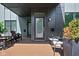 Charming front porch providing seating, stylish accents, and curb appeal at 2140 Alabama St, Indianapolis, IN 46202