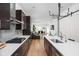 Spacious kitchen with island seating and pendant lighting offering access to open concept living at 2140 Alabama St, Indianapolis, IN 46202