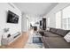 Open-concept living area offering hardwood floors, modern furniture, and plenty of space at 2140 Alabama St, Indianapolis, IN 46202