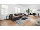Spacious living room with hardwood floors, a comfortable couch, and modern decor at 2140 Alabama St, Indianapolis, IN 46202