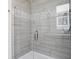 Beautiful tile in glass enclosed shower with built in niche for bath products at 2140 Alabama St, Indianapolis, IN 46202