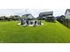 Expansive backyard with a pool, firepit area, and multiple gazebos, perfect for outdoor entertaining and relaxation at 2245 Meadow Crk, Avon, IN 46123