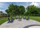 Outdoor firepit area with comfortable Adirondack chairs and a lush green lawn, perfect for entertaining guests at 2245 Meadow Crk, Avon, IN 46123