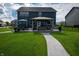 Beautiful backyard featuring a covered patio, a dining area, and a well-manicured lawn at 2245 Meadow Crk, Avon, IN 46123