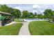 Spacious backyard featuring a pristine pool, well-manicured lawn, and a cozy gazebo with ample seating at 2245 Meadow Crk, Avon, IN 46123