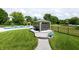 Expansive backyard with a gazebo, a swimming pool, lounge chairs, and well-maintained landscaping at 2245 Meadow Crk, Avon, IN 46123