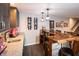 Finished basement wet bar featuring granite counters, wine rack, and seating at 2245 Meadow Crk, Avon, IN 46123