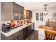 Beautiful basement wet bar with custom cabinets, granite countertops, and wine refrigerator at 2245 Meadow Crk, Avon, IN 46123