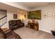 Inviting basement with a comfortable sofa, TV, and sports-themed decorations at 2245 Meadow Crk, Avon, IN 46123