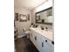 Well-appointed bathroom featuring a vanity with white countertop, framed mirror, and stylish decor at 2245 Meadow Crk, Avon, IN 46123