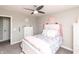 Comfortable bedroom features a bed with floral bedding, natural light, and inviting decor at 2245 Meadow Crk, Avon, IN 46123