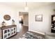 Well-decorated entryway with rustic cabinet and doorway to a spacious living area at 2245 Meadow Crk, Avon, IN 46123