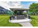 Outdoor gazebo featuring comfortable seating, tropical plants, outdoor TV, and a stylish entertainment area at 2245 Meadow Crk, Avon, IN 46123