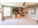 Comfortable home theater with a large screen TV, ceiling fan, and movie posters at 2245 Meadow Crk, Avon, IN 46123