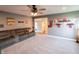 Cozy home theater with a gray sofa, movie decor, and comfortable carpeting at 2245 Meadow Crk, Avon, IN 46123