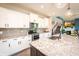Modern kitchen with granite countertops, stainless steel appliances, and white cabinetry at 2245 Meadow Crk, Avon, IN 46123