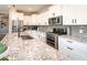 Bright kitchen featuring a large island, stainless steel appliances, and stylish finishes at 2245 Meadow Crk, Avon, IN 46123