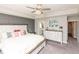 Spacious main bedroom featuring stylish décor, a tray ceiling, and comfortable furnishings at 2245 Meadow Crk, Avon, IN 46123