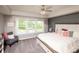 Serene main bedroom with a tray ceiling, pool view, and decorative wall paneling at 2245 Meadow Crk, Avon, IN 46123