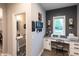 Bright home office featuring a built-in desk, natural light, and modern décor at 2245 Meadow Crk, Avon, IN 46123