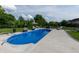 Inviting in-ground pool with surrounding patio and meticulously manicured lawn at 2245 Meadow Crk, Avon, IN 46123