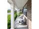Charming front porch featuring comfortable rocking chairs, decorative pillows, and a view of the neighborhood at 2245 Meadow Crk, Avon, IN 46123
