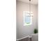 Bright staircase with a window view, modern chandelier, and neutral tones, creating an inviting space at 2245 Meadow Crk, Avon, IN 46123