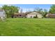 Large backyard with a patio area, shed, and plenty of space for recreation at 2303 Alexandria Dr, Greenfield, IN 46140