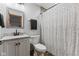 Modern bathroom with white vanity, tiled shower, and decorative printed shower curtain at 2303 Alexandria Dr, Greenfield, IN 46140