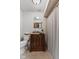 Bathroom with toilet and vanity with sink, with shower behind a shower curtain at 2303 Alexandria Dr, Greenfield, IN 46140