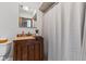 Bathroom vanity with tile floors, granite counters, and shower with updated fixtures at 2303 Alexandria Dr, Greenfield, IN 46140