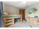 Neutrally decorated bedroom featuring carpet floors, a bunk bed and mounted television at 2303 Alexandria Dr, Greenfield, IN 46140