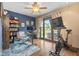 Cozy bedroom or home office featuring a ceiling fan and a view of the outdoor patio at 2303 Alexandria Dr, Greenfield, IN 46140