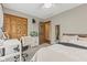 Neutral bedroom featuring carpet floors, a ceiling fan, and closet with wood doors at 2303 Alexandria Dr, Greenfield, IN 46140