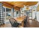 Dining room with wood table and ceiling with sliding glass door to backyard at 2303 Alexandria Dr, Greenfield, IN 46140