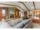 Cozy living room features a stone fireplace, exposed wood beams, and a comfortable seating area at 2303 Alexandria Dr, Greenfield, IN 46140