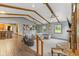 Inviting living room with a stone fireplace, vaulted ceilings, and an open layout to the kitchen at 2303 Alexandria Dr, Greenfield, IN 46140