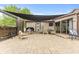 Inviting outdoor patio area with a shade structure, comfortable seating, and a grill at 2303 Alexandria Dr, Greenfield, IN 46140