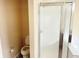 Bathroom featuring a toilet, and glass-doored shower at 2444 Cole Branch Ct, Indianapolis, IN 46239