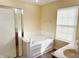 Bright bathroom with walk-in shower, large soaking tub, and double sinks at 2444 Cole Branch Ct, Indianapolis, IN 46239