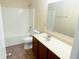 Bathroom with a sink vanity, toilet and bathtub with showerhead at 2444 Cole Branch Ct, Indianapolis, IN 46239