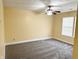 Bedroom featuring neutral carpeting, walls, and a ceiling fan at 2444 Cole Branch Ct, Indianapolis, IN 46239