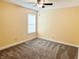 Bedroom featuring neutral carpeting, walls, and a window at 2444 Cole Branch Ct, Indianapolis, IN 46239
