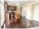 Well-lit kitchen features stainless appliances, an island, and wood floors at 2444 Cole Branch Ct, Indianapolis, IN 46239