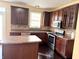 Well-equipped kitchen featuring wooden cabinets, stainless steel appliances, and ample counter space at 2444 Cole Branch Ct, Indianapolis, IN 46239