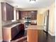 Well-equipped kitchen featuring wooden cabinets, stainless steel appliances, and ample counter space at 2444 Cole Branch Ct, Indianapolis, IN 46239