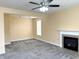 Large living room features a fireplace and modern ceiling fan at 2444 Cole Branch Ct, Indianapolis, IN 46239