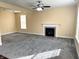 Spacious living room features a fireplace, neutral paint, and ceiling fan at 2444 Cole Branch Ct, Indianapolis, IN 46239